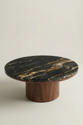 Round marble table with wooden base on a light background