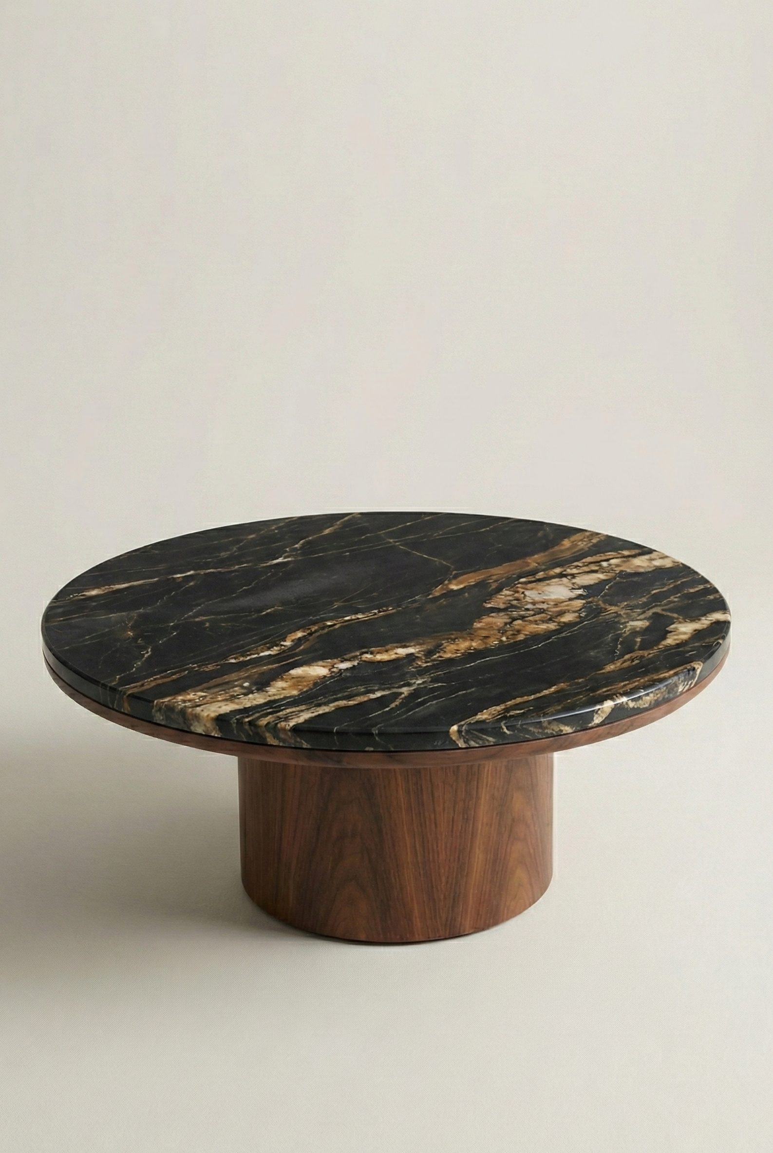 Round marble table with wooden base on a light background